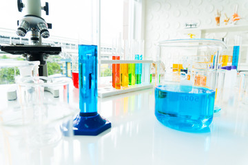 science research laboratory concept . Equipment in science laboratory Glassware containing chemical liquid for experiments and microscope