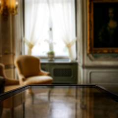 Table background of free space for your decoration and blurred background of xmas window 