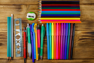 Set of school stationery supplies on a wooden desk. Back to school concept