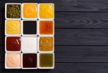 Fototapeta premium Set of different sauces in ceramic bowl