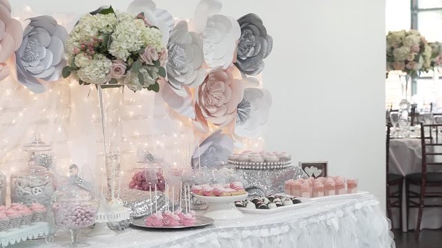 Wedding floral and dessert table arrangements