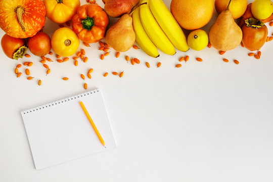 Fresh Autumn Yellow And Orange Vegetables And Fruits And Notebook Isolated On White Background, Top View. Flat Lay. Autumn Background.