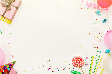 Birthday party background. party hats, balloons, streamers and confetti with copy space