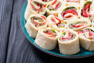 Sliced sandwich tortilla with vegetables and ham