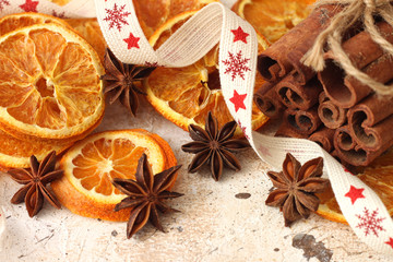 Obraz na płótnie Canvas Dried oranges with anise and cinnamon sticks