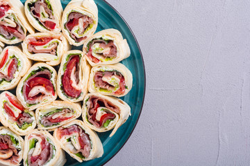 Sliced sandwich tortilla with vegetables and ham