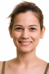 Face of happy young beautiful woman smiling with hair tied