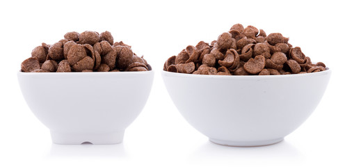 chocolate cereals in white bowl on white background. Cornflakes