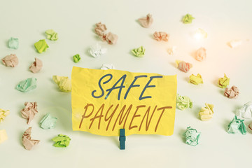 Word writing text Safe Payment. Business photo showcasing webpage where credit card numbers are entered is secured Colored crumpled papers empty reminder white floor background clothespin