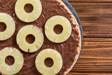 Fruit pizza with nut nougat cream and pineapple