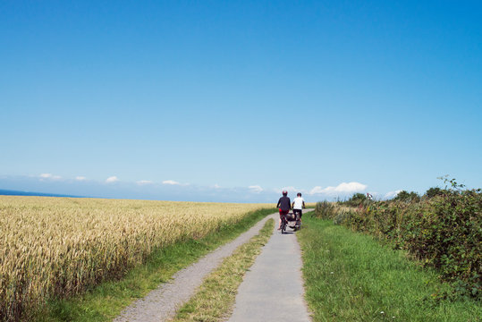 Couple cycling on rural road