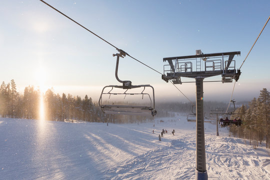 Ski lift above snow