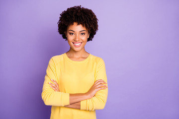 Photo of trendy sweet pretty attractive young representative of business people community standing confidently with arms crossed smiling toothily wearing yellow sweater isolated over purple pastel