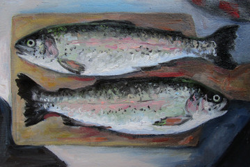Two fishes. Trout on a wooden board.