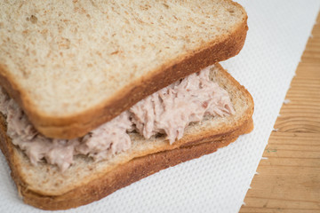 Tuna mayo sandwich with wheat bread.