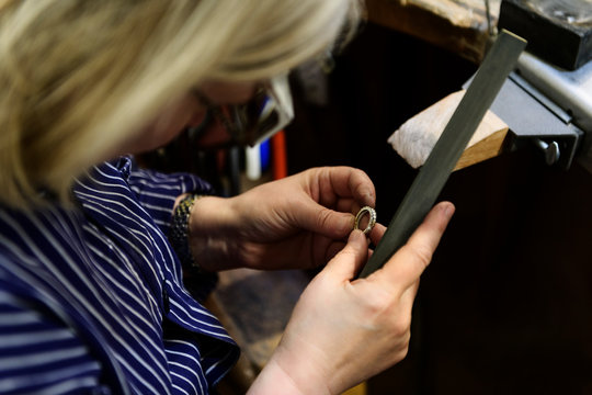Goldsmith working on ring