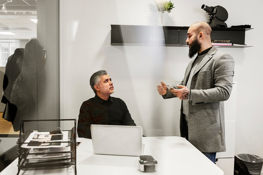 Men Talking In Office
