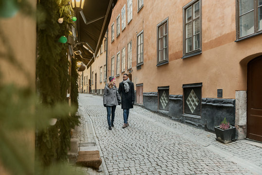 Couple holding hands on street in Stockholm, Sweden