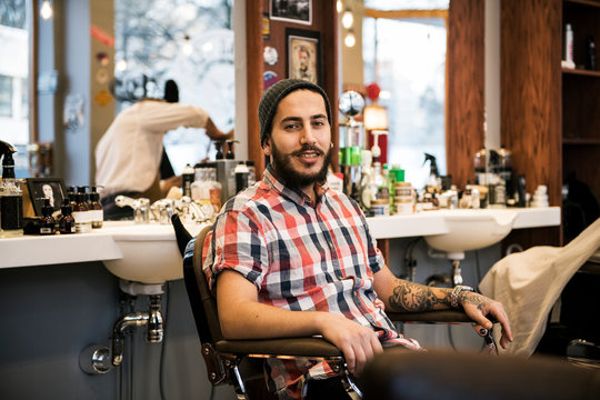 Portrait of barber sitting in barber?s chair