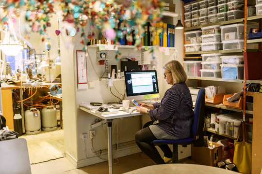 Goldsmith working at computer