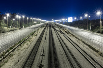 Fototapeta na wymiar Empty Freeway And Railway And Night
