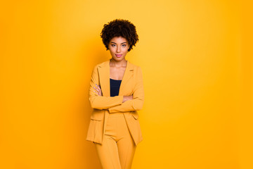 Portrait of her she nice-looking attractive charming pretty calm content wavy-haired girl folded arms summer clothing trend isolated over bright vivid shine vibrant yellow color background