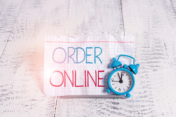 Writing note showing Order Online. Business concept for activity of buying products or services over the Internet