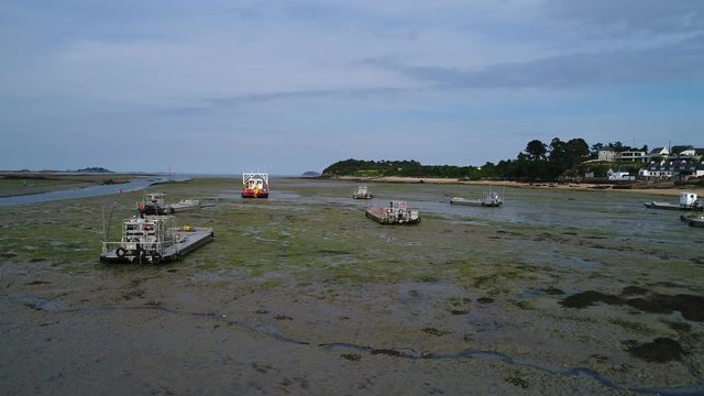 Aerial view. Fishing boats aground at low tide in the town of Paimpol in Northern France, in Brittany.
