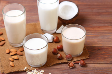 Different types of vegetable milk on the table. Coconut, oatmeal, hazelnut, almond milk. Vegetarian milk.