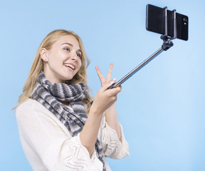 Smiley young girl taking a selfie
