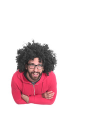 top view .cheerful curly-haired guy looking at the camera