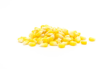 Piles of fresh corn kernels close-up isolated on white background