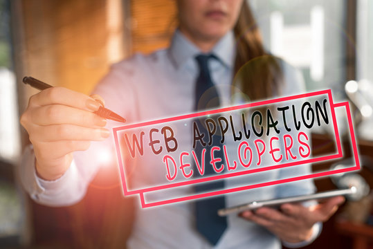 Text sign showing Web Application Developers. Business photo text Internet programming experts Technology software Blurred woman in the background pointing with finger in empty space