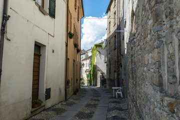 Narrow alley in the ancient village of Compiano in Italy 