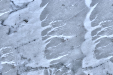 granite wall surface, facade, red-gray with black dots