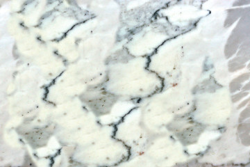 granite wall surface, facade, red-gray with black dots
