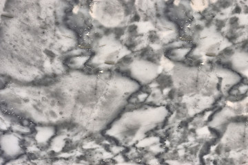 granite wall surface, facade, red-gray with black dots