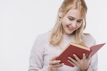 Front view young woman reading a book