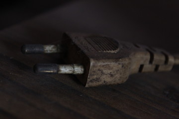 single old / dusty plug in the table