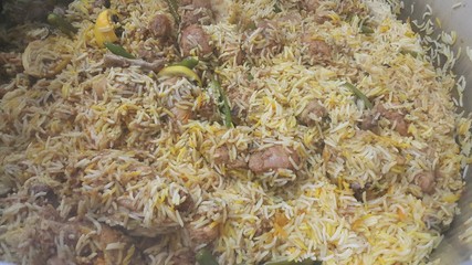 A close up  view of cooked rice chicken biryani made with traditional recipe