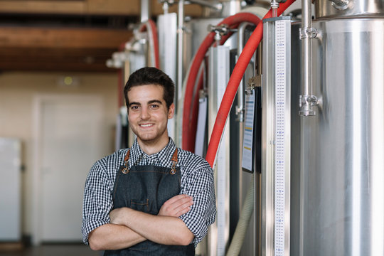 Portrait of confident young brewer at a brewery - Powered by Adobe