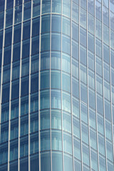 Fototapeta na wymiar Modern glass silhouettes on modern building