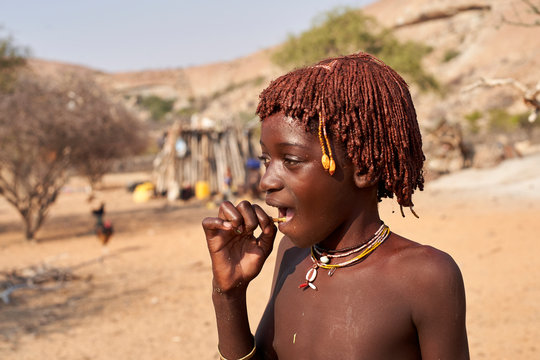 Young mucubal girl in her traditional hairstyle, Tchitundo Hulo, Virei, Angola