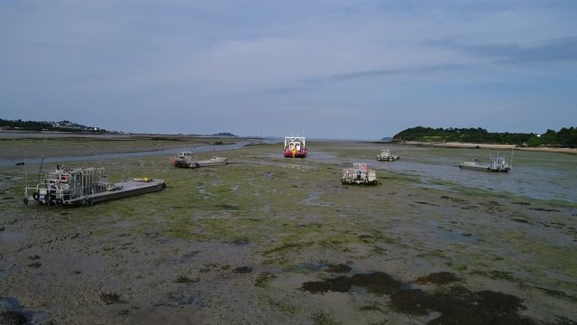 Aerial view. Fishing boats aground at low tide in the town of Paimpol in Northern France, in Brittany.
