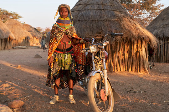 Proud Muhila woman and her bike, Kehamba, Chibia, Angola
