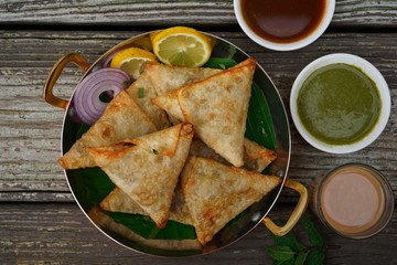 Homemade Samosas wiith Chutneys/Diwali snacks, selective focus