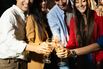 Group of friend enjoy the Christmas new year party with happiness. Friend drinking wine in the party.