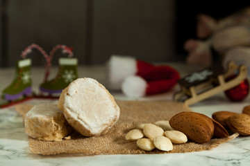 Christmas polvorones with Christmas ornaments on unfocused background