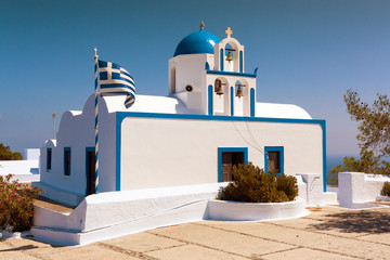The little white church on Santorini's island in Greece