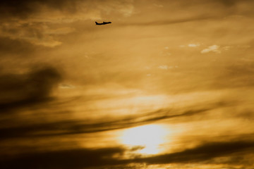 Aircraft departing late evening before sunset over the 